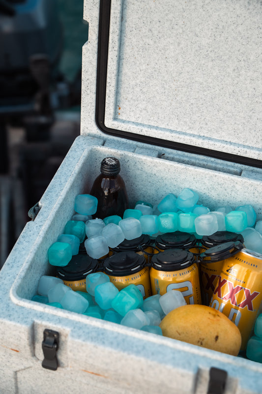 Open cooler filled with reusable ice cubes keeping drinks cold