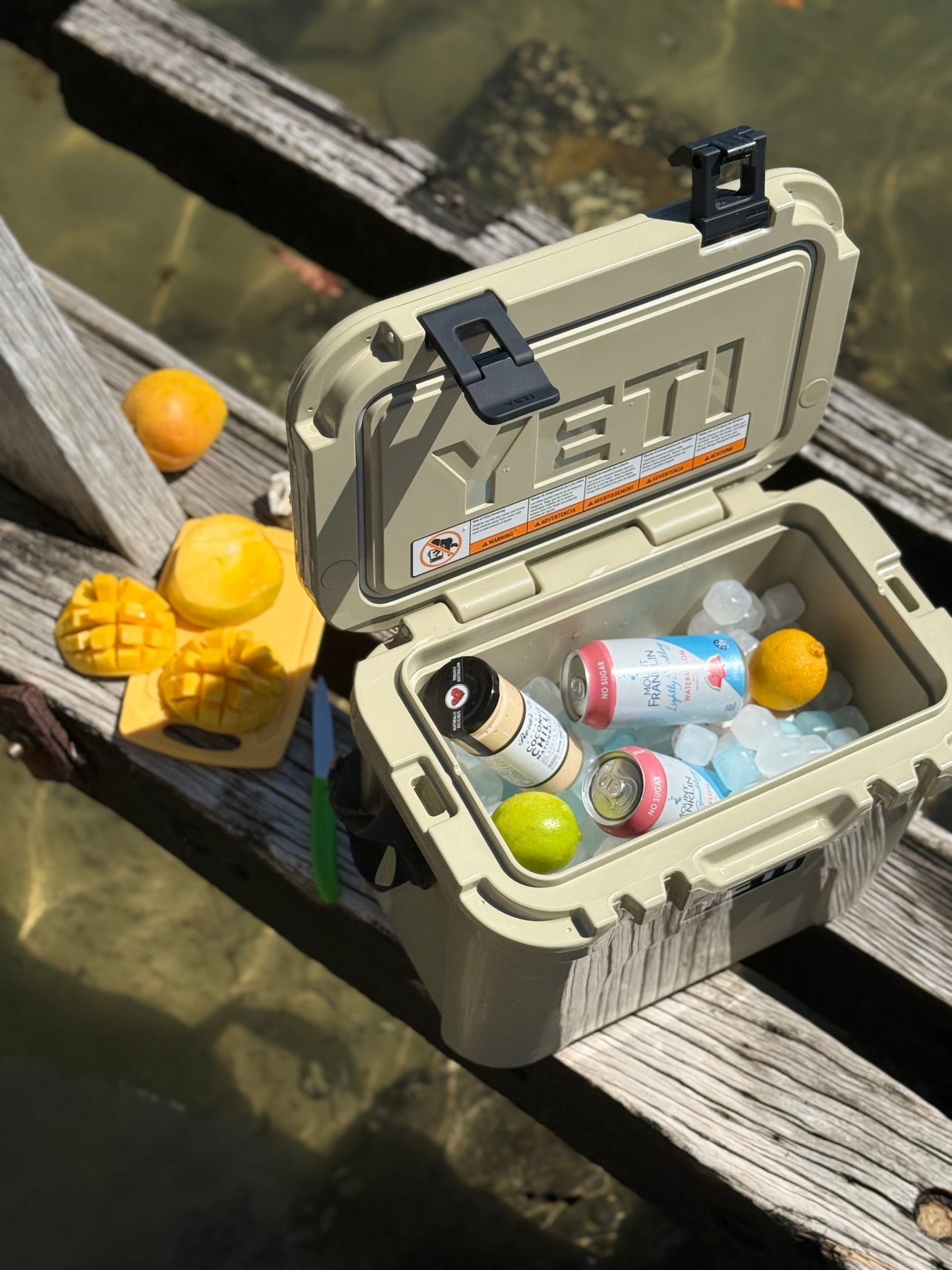 YETI cooler on a dock kept chilled in a cooler using Qubes reusable ice cubes