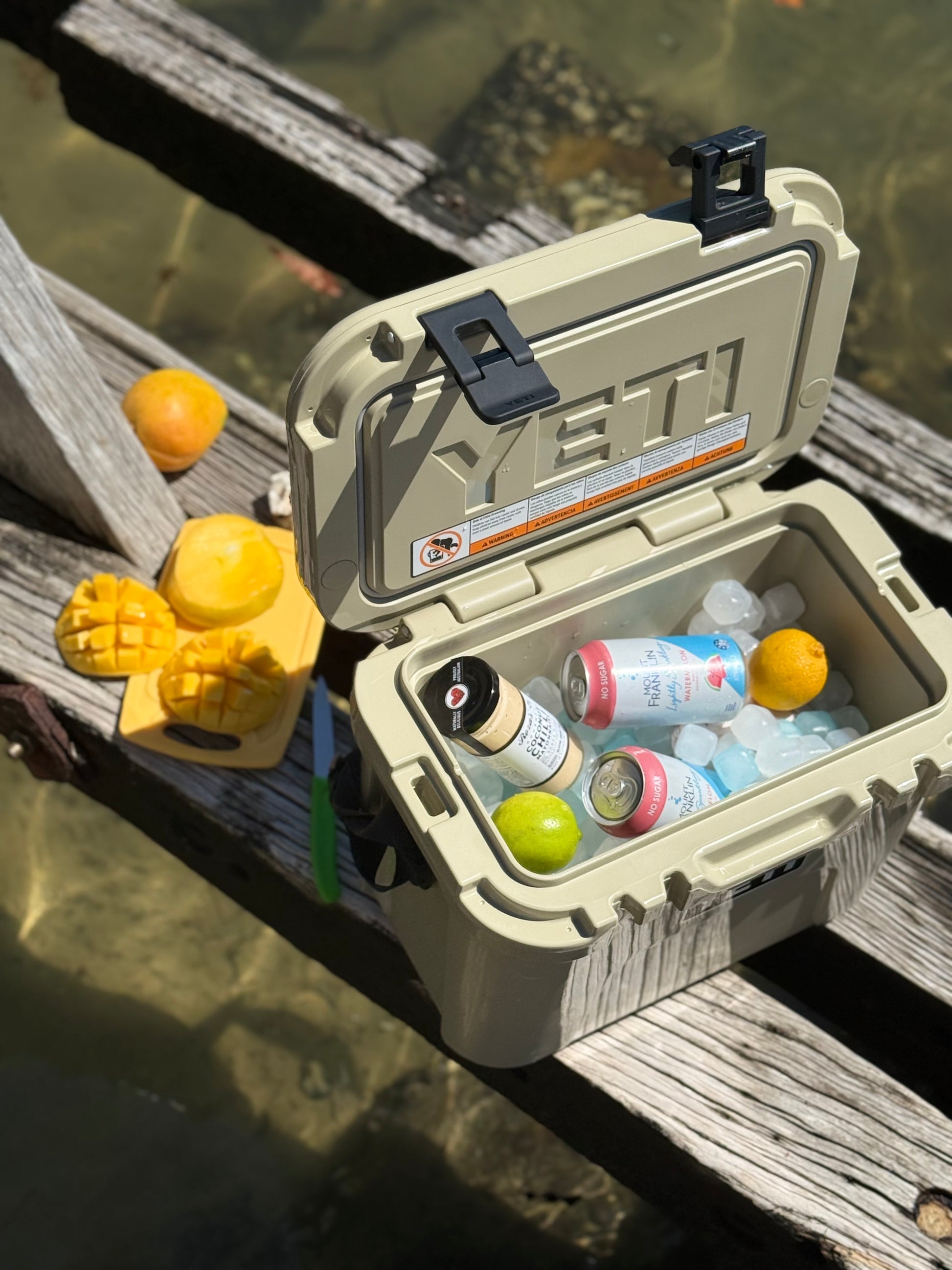 YETI cooler on a dock kept chilled in a cooler using Qubes reusable ice cubes